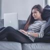 Person on laptop sitting on couch