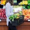 Person shopping for fruits and vegetables.