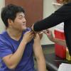 Student getting flu shot on campus
