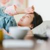 Person lying in bed sick