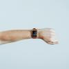 Person checks time on Apple Watch