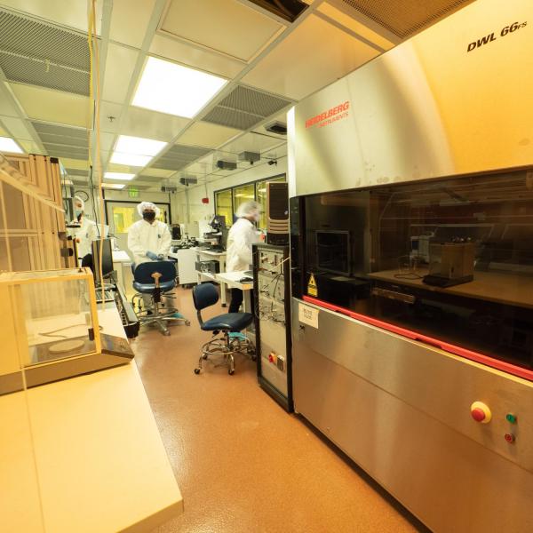 two people in a lab with a lot of instruments