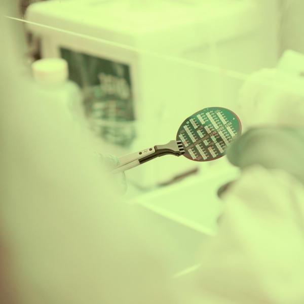 A person spraying down an instrument