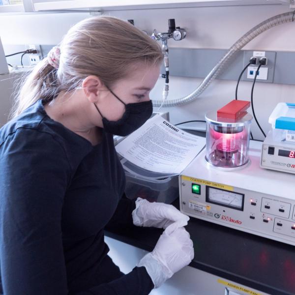 A person working with lab equipment