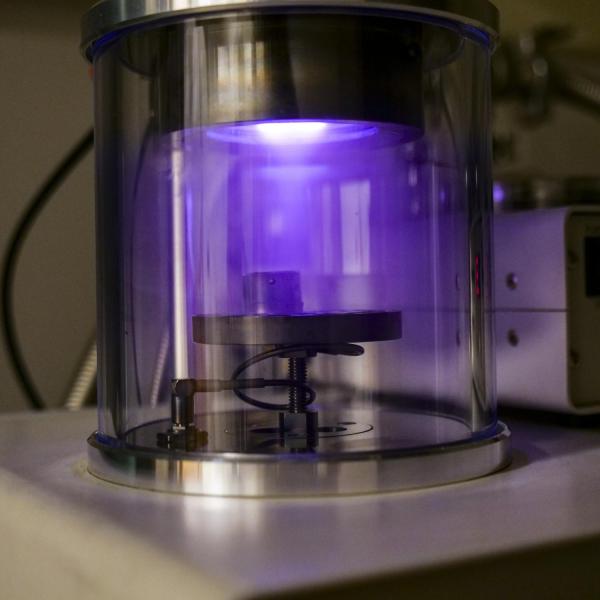 A close up of a tube with purple light.