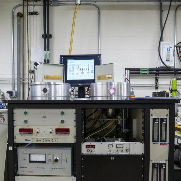 A movable cart with lab equipment on it.