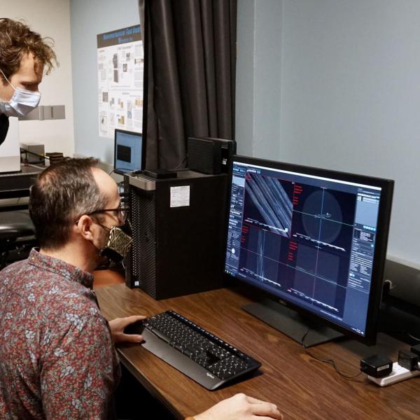 Kevin Eckstein and Adrian Gestos studying images from the Dragonfly