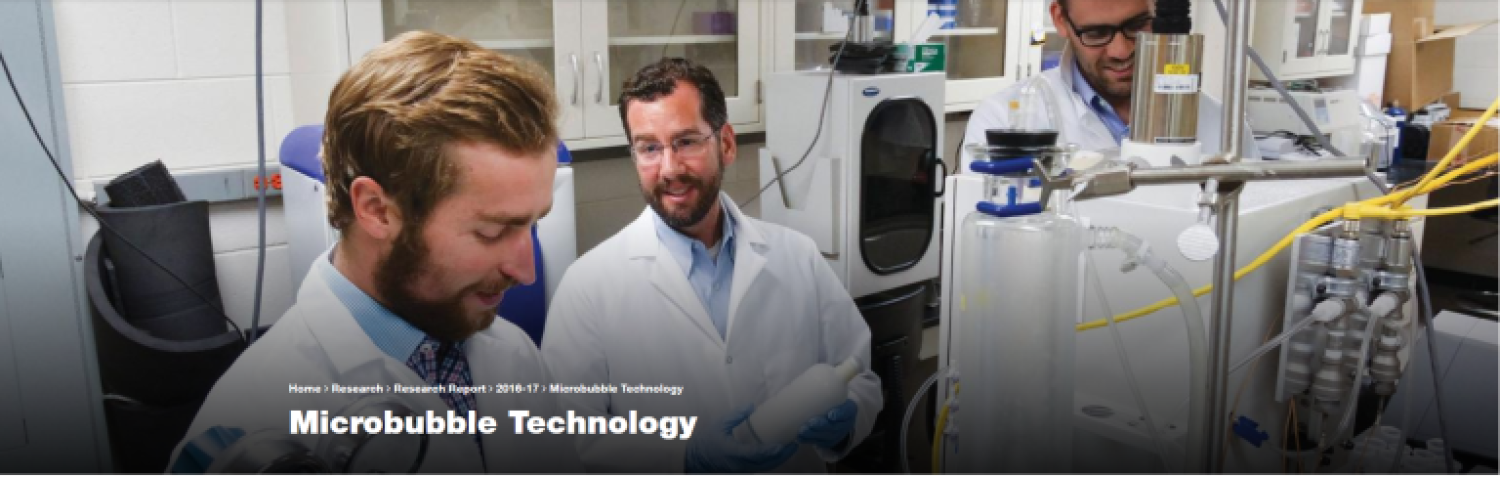 3 guys working in a lab