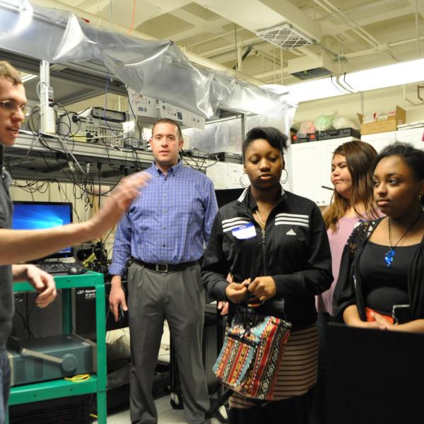 Graduate student Kenneth Underwood explaining ultrafast lasers.