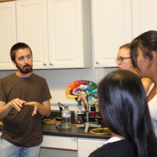 Kevin showing the students the brain and the areas that we will study.
