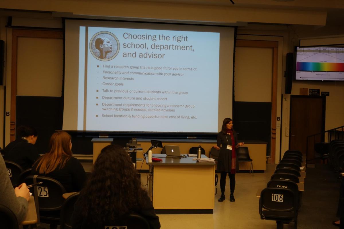 Juliet in front of a classroom, presenting a slide show