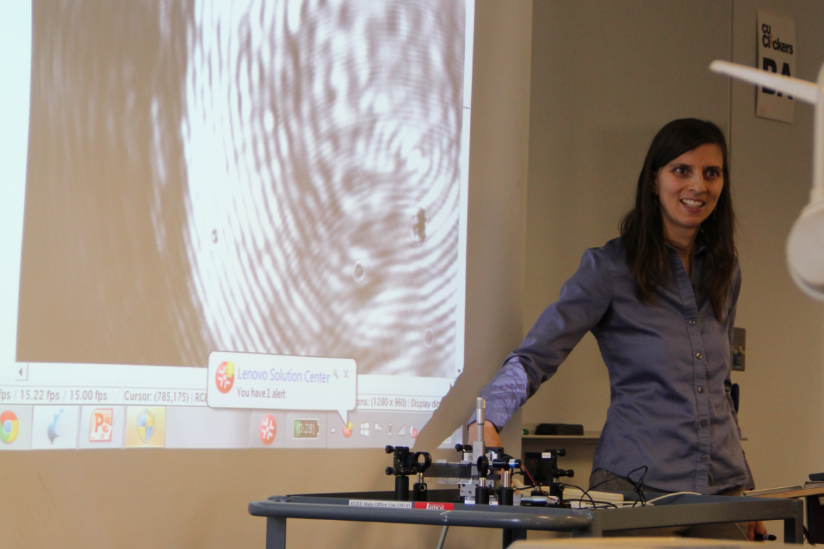 Juliet presents on orbital angular momentum in the classroom using a transparency.
