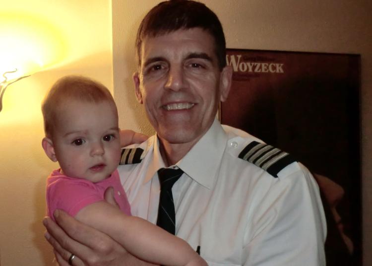 Laura's husband holding baby Shira