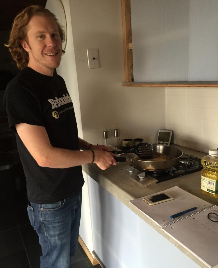 Photograph of a scientist cooking an egg within a passive house