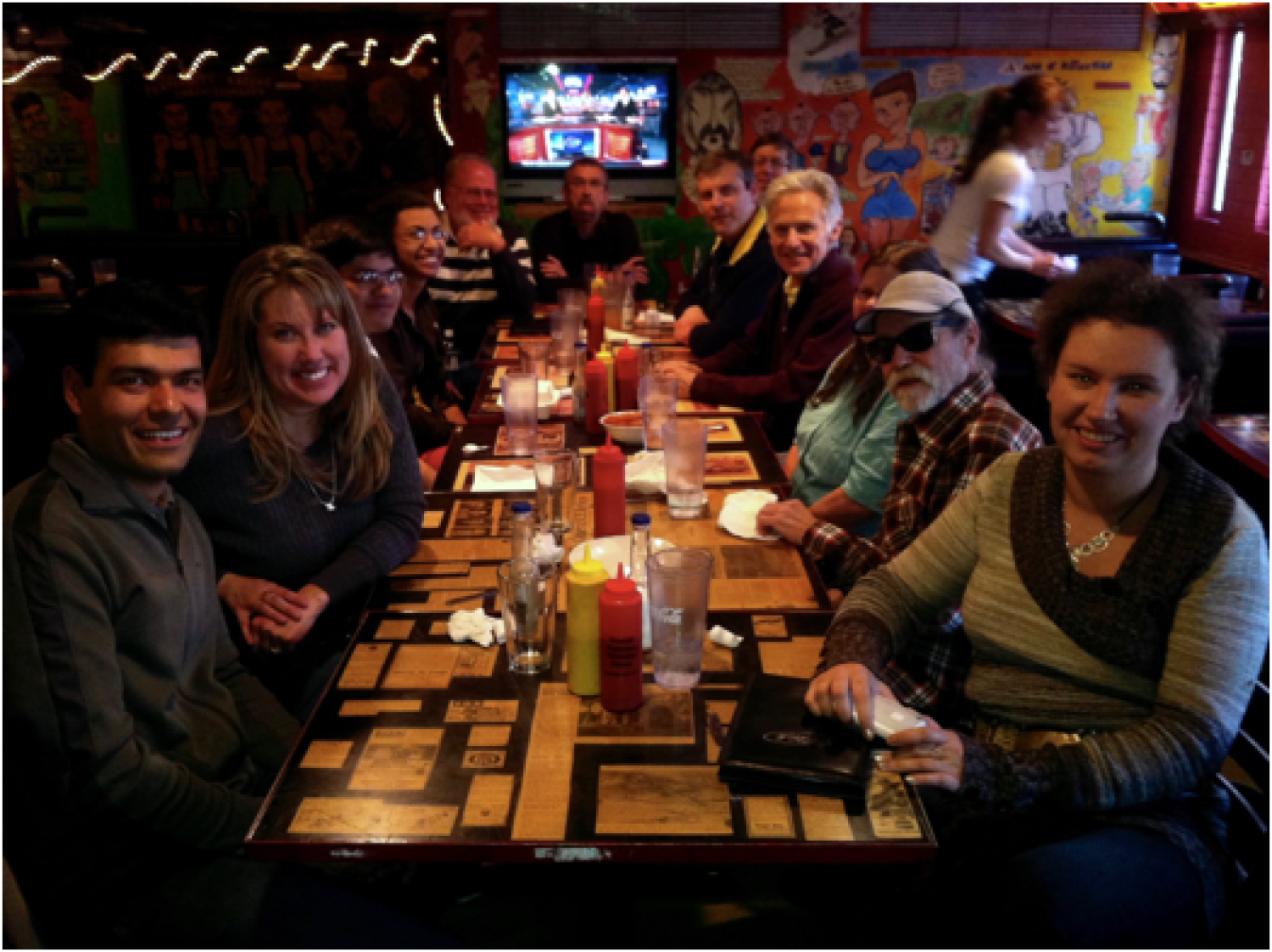 Dr. Moddel with his lab members at a restaurant