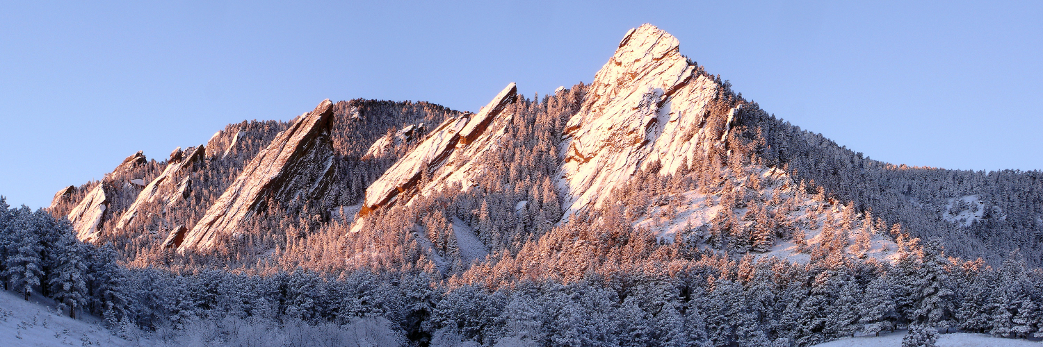 the Flatirons covered in snow