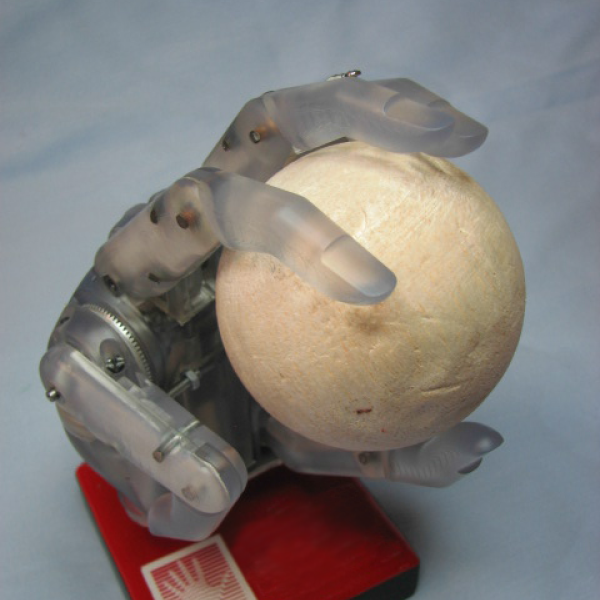 A Prosthetic Hand holding a ball.
