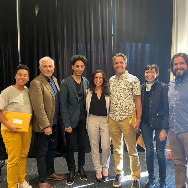 Faculty honorees standing and posing together at Fall 2022 event