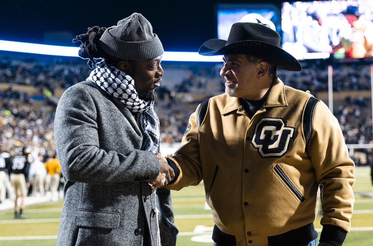 Kalonji Nzinga and Chancellor Schwartz shaking hands