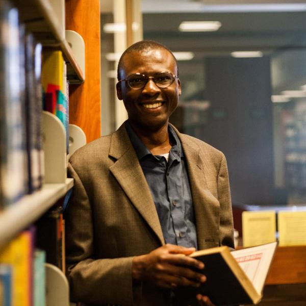 	Omedi	Ochieng,	Associate Professor 