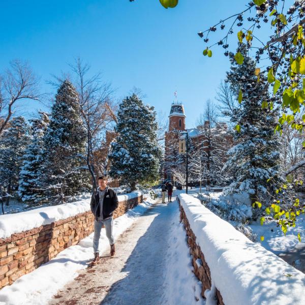 student walking in snow