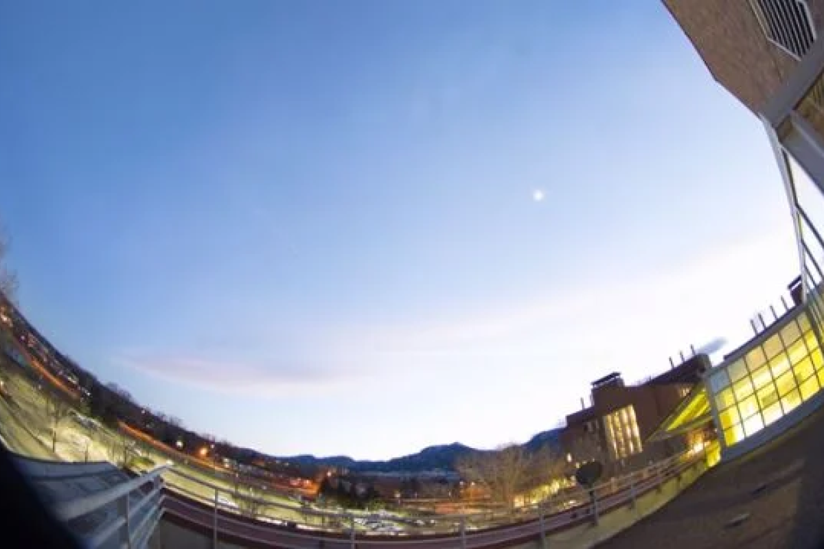 Still image of short film with a cityscape and sky