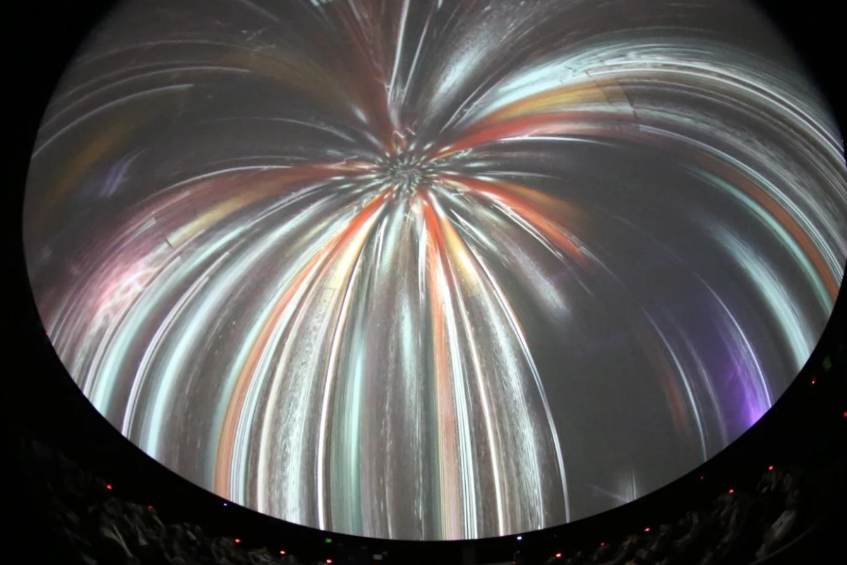 Interior of dome with fireworks on the screen