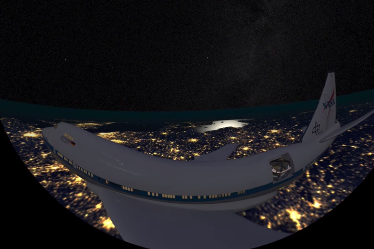 Still image from short film of SOPHIA aircraft flying over a city at night