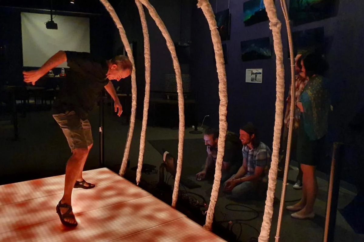 John Keller dancing in the solar arcade exhibit