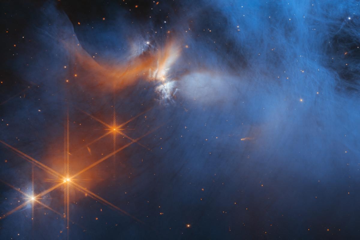 Image of several stars and emission nebula