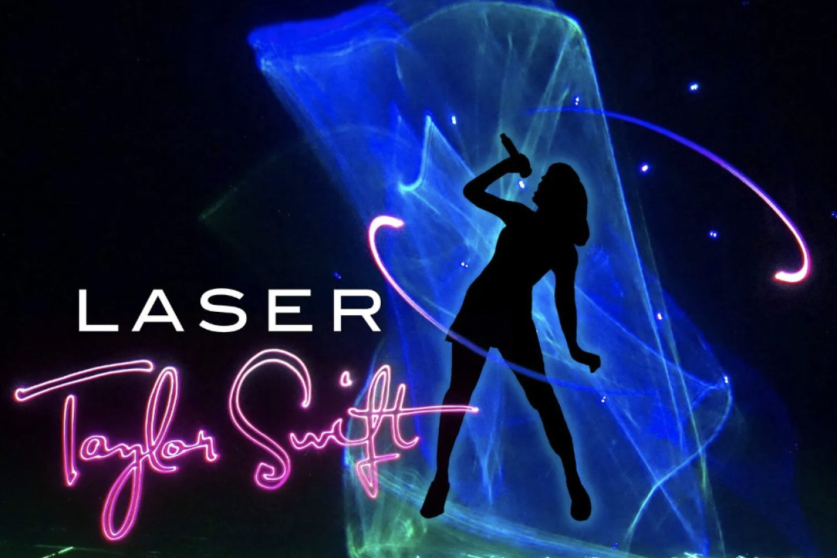 Laser Taylor Swift with green lasers and her silhoutte in black against blue lasers