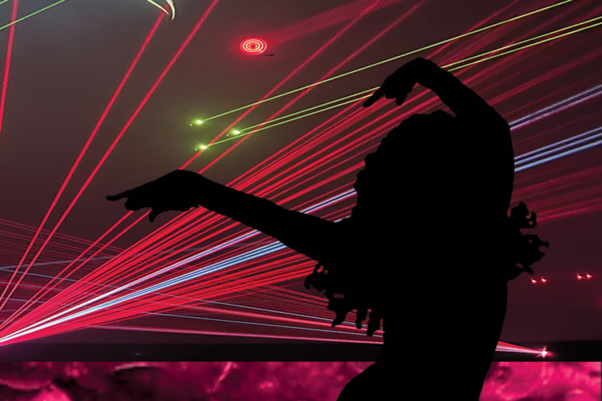 Silhoutte of artist with red and pink lasers in the background