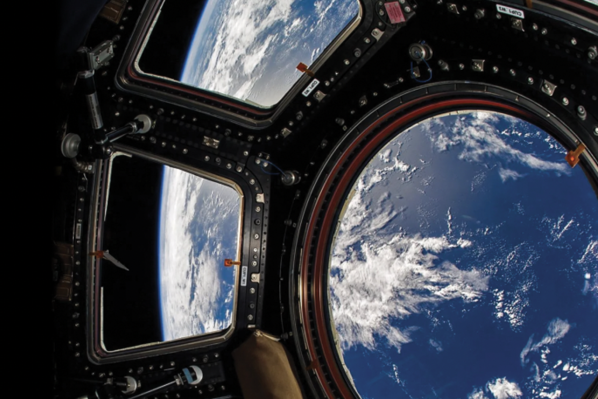 Photo showing the cupola on the ISS with earth