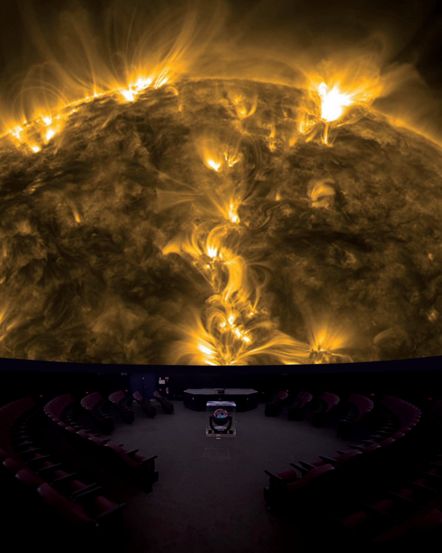 Photo of the interior of Fiske theater with image of Sun from SDO