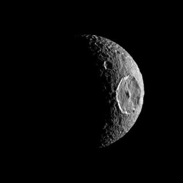 NASA image showing Saturn's Moon Mimas which looks like a Star Wars Death star