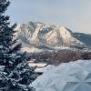 Photo looking at the Flatirons in the snow with Fiske dome in view to the lower right