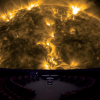 Photo of the interior of Fiske theater with image of Sun from SDO