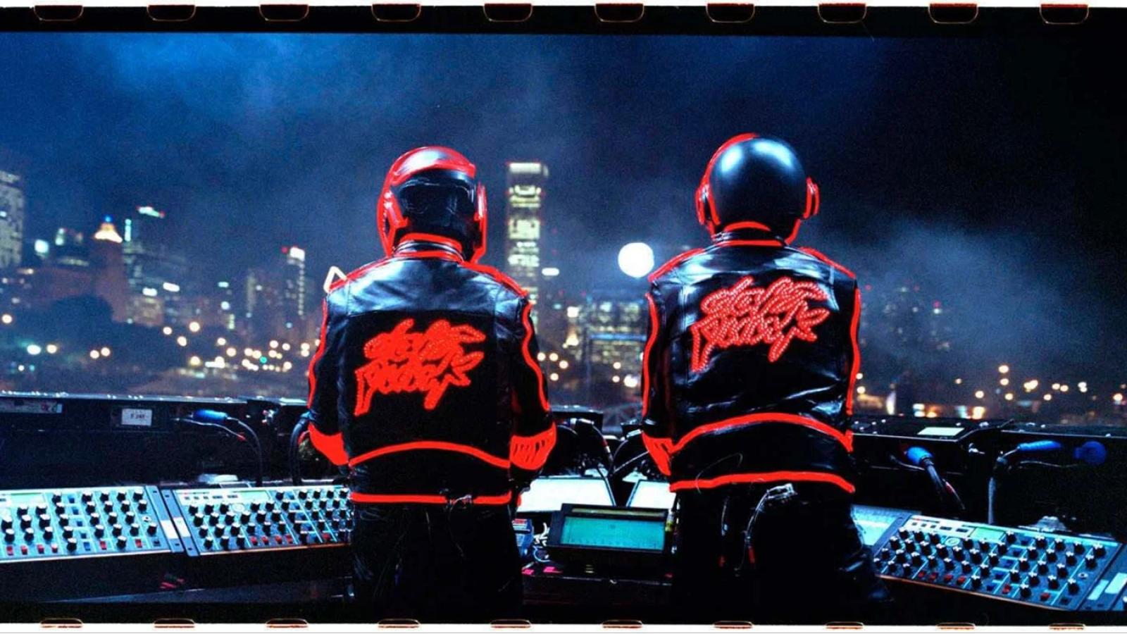 Photo of the band members backs with jackets with daft punk written on the back in front of a console with a city scape in view