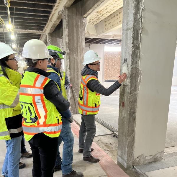people looking at construction progress