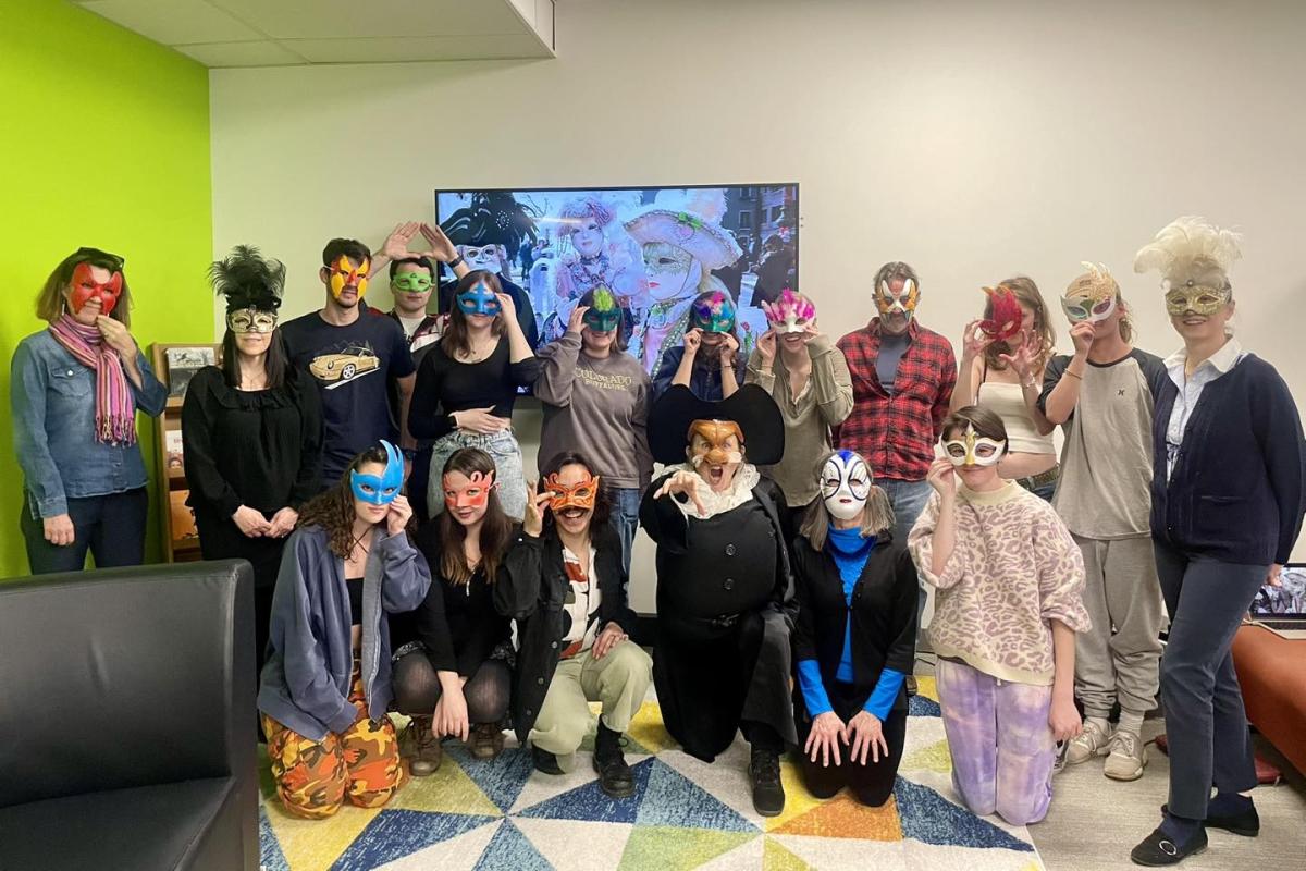 Students with masks for Mardi Gras