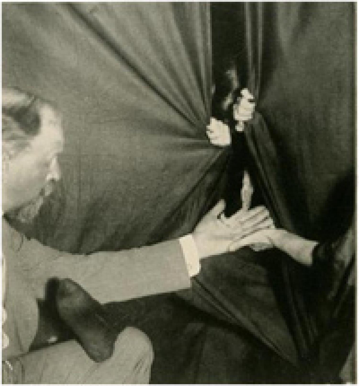 Figure 1: A flashlight photograph of Eva producing ectoplasm from the medium’s cabinet. Schrenck-Notzing appears on the left. Image courtesy of Hathi Trust.