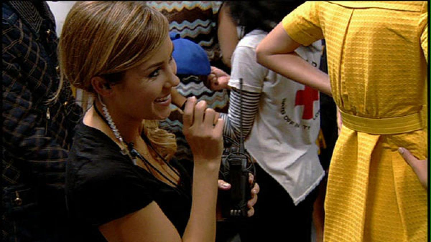 Figure 1: A woman looking at another woman in a yellow dress
