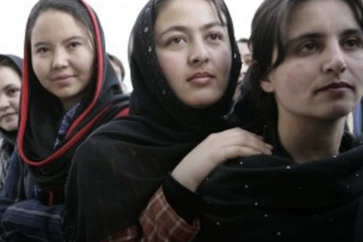 Row of 4 women standing side by side