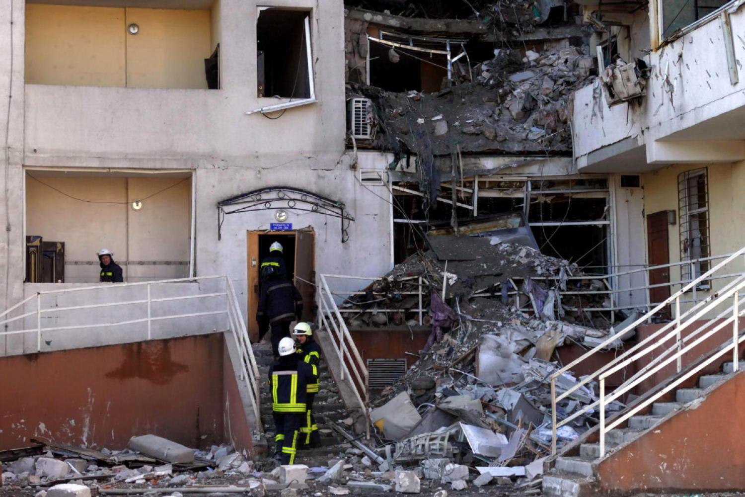 Rescuers work to remove debris from a building that was hit in a military strike, amid Russia's invasion, in Odesa, Ukraine, April 24, 2022. REUTERS/Igor Tkachenko