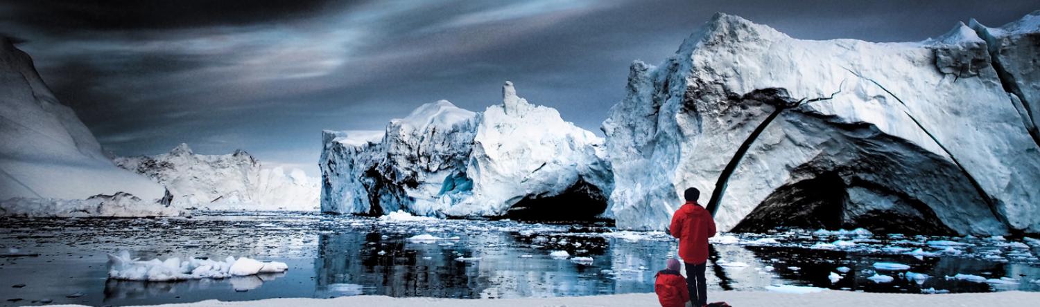 2 people looking at arctic ice at night