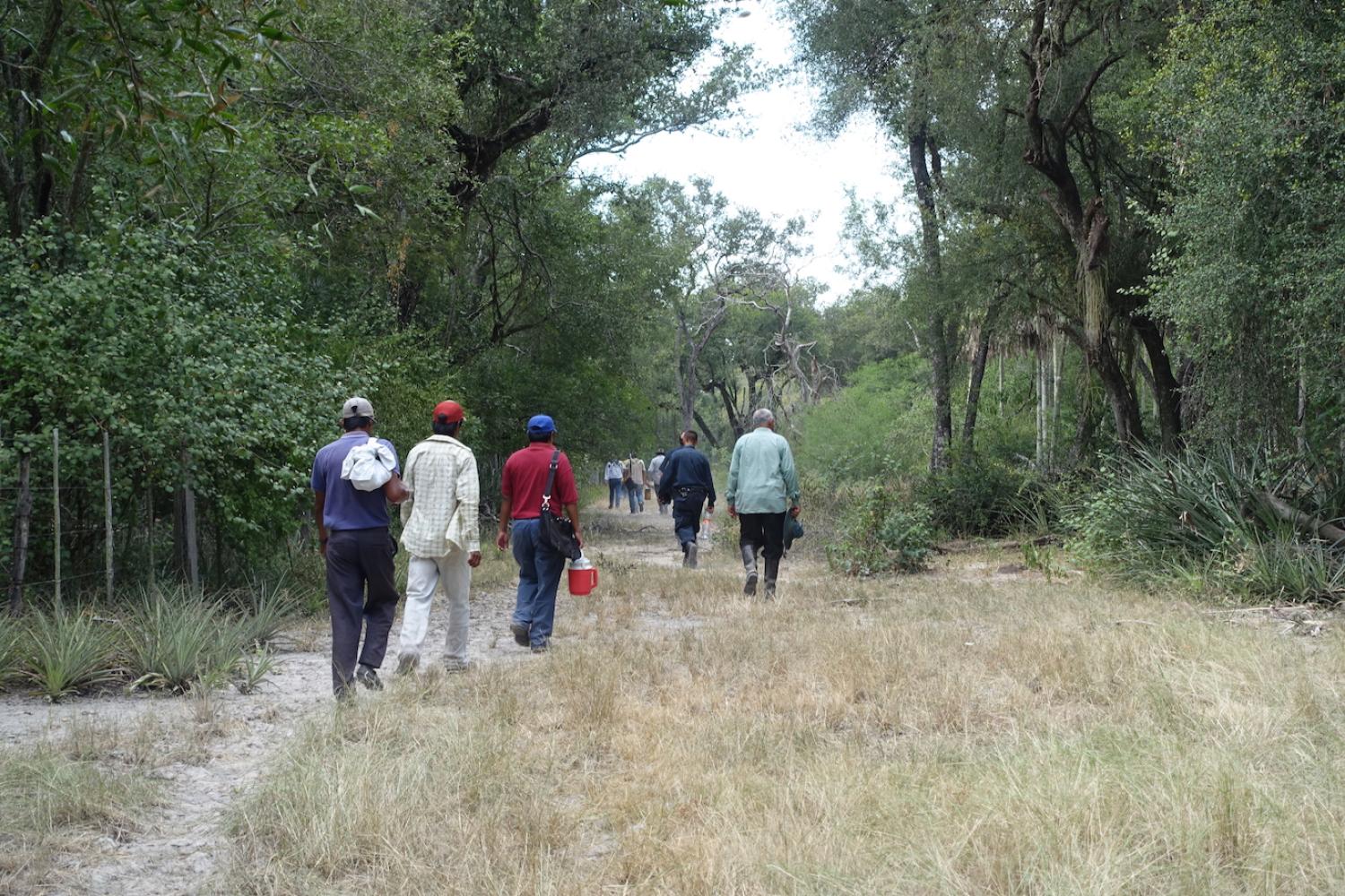 People walking a trail on the Yakye Axa property