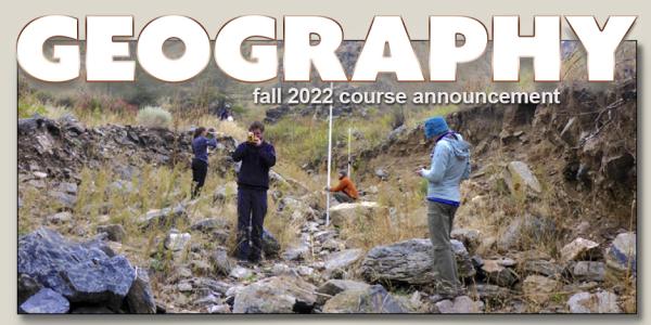 People taking measurements in dry creek bed