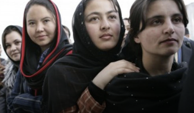 Row of 4 women standing side by side