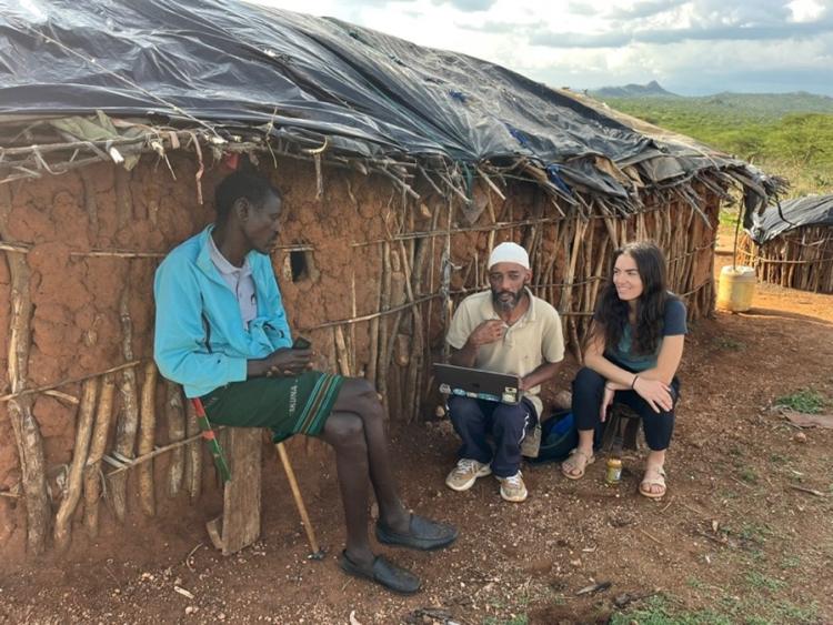 Posner and her Research Assistant, Noor Hussein Noor, piloting the questionnaire with a Samburu pastoralist at his manyatta (homestead) March 2025.