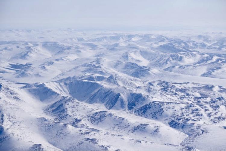 Aerial shot of arctic mountains covered in snow